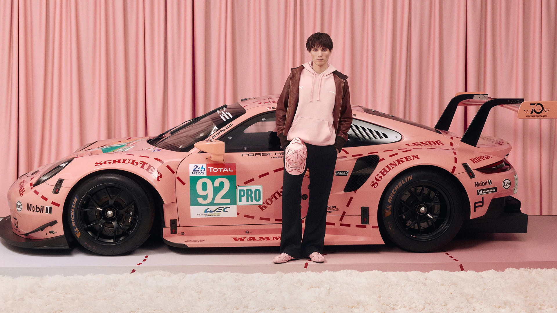 Fashion Industry News: Guess Taps Hyunjin for Spring Campaign, H&M’s Spring 2026, Towson University’s UStore, Scot Louie Curates for SHEIN, New York Liberty Official Sunglass Partner, "Pink Pigs" Racing Livery, TOMMY JEANS Spring 2026, Nike Unveils 2026 Federation Kits, Bershka’s OUT OF CORE Line & Carolina Herrera Spring 2026 Collection 19 puma media hub article racing pink porsche img 01